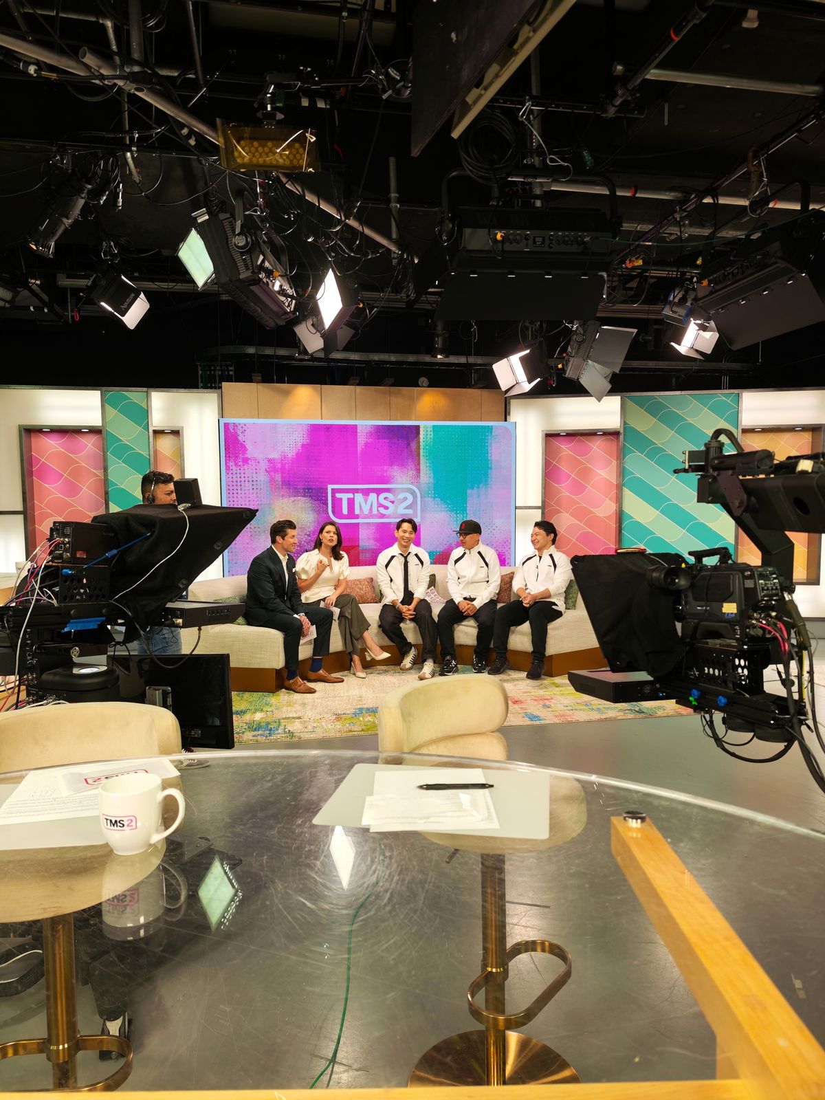 Jonathan Wong, Simon Yin and Howie Lai on the Global TV set